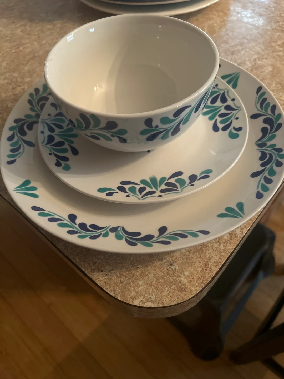 White Dinnerware Set with Blue and Teal Floral Design