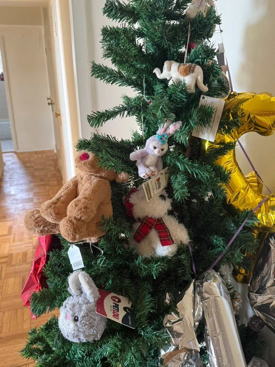 Assorted Stuffed Animals and Ornaments on Christmas Tree - photo 2