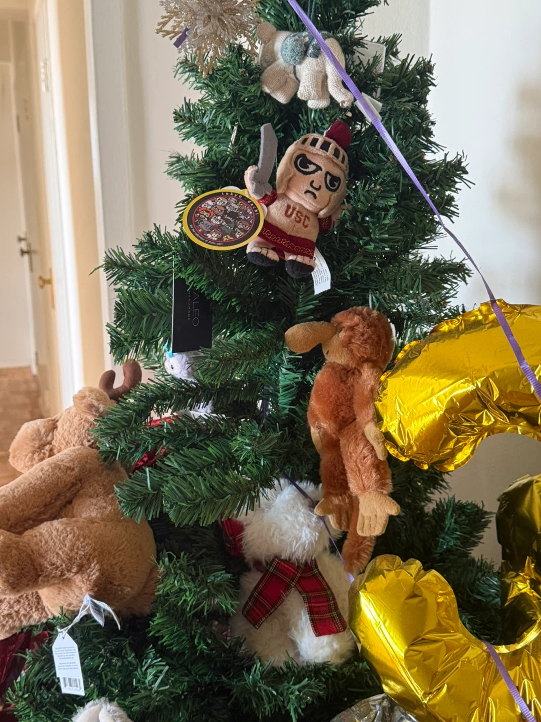 Assorted Stuffed Animals and Ornaments on Christmas Tree
