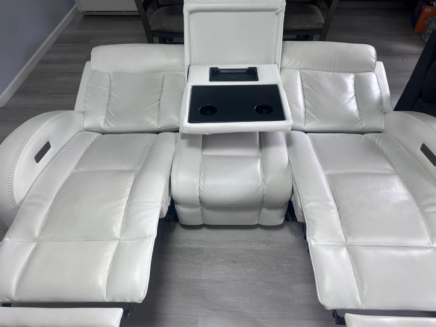Bob’s Furniture White Leather Recliner Sofa with Center Console - photo 2