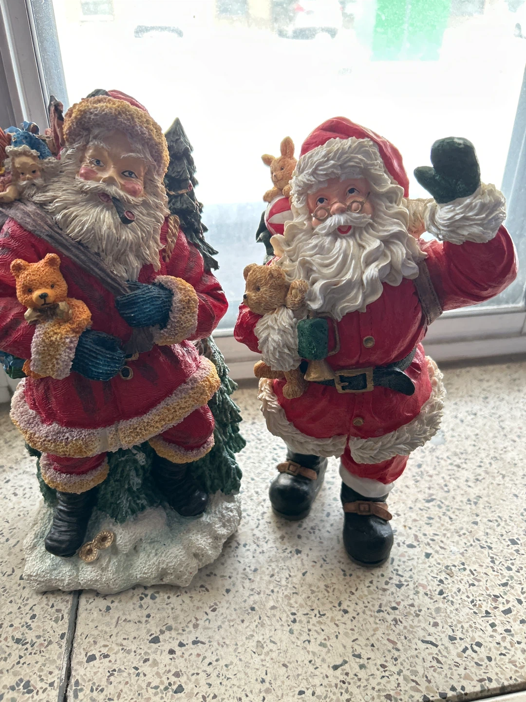 Two Santa Claus Figurines with Teddy Bears