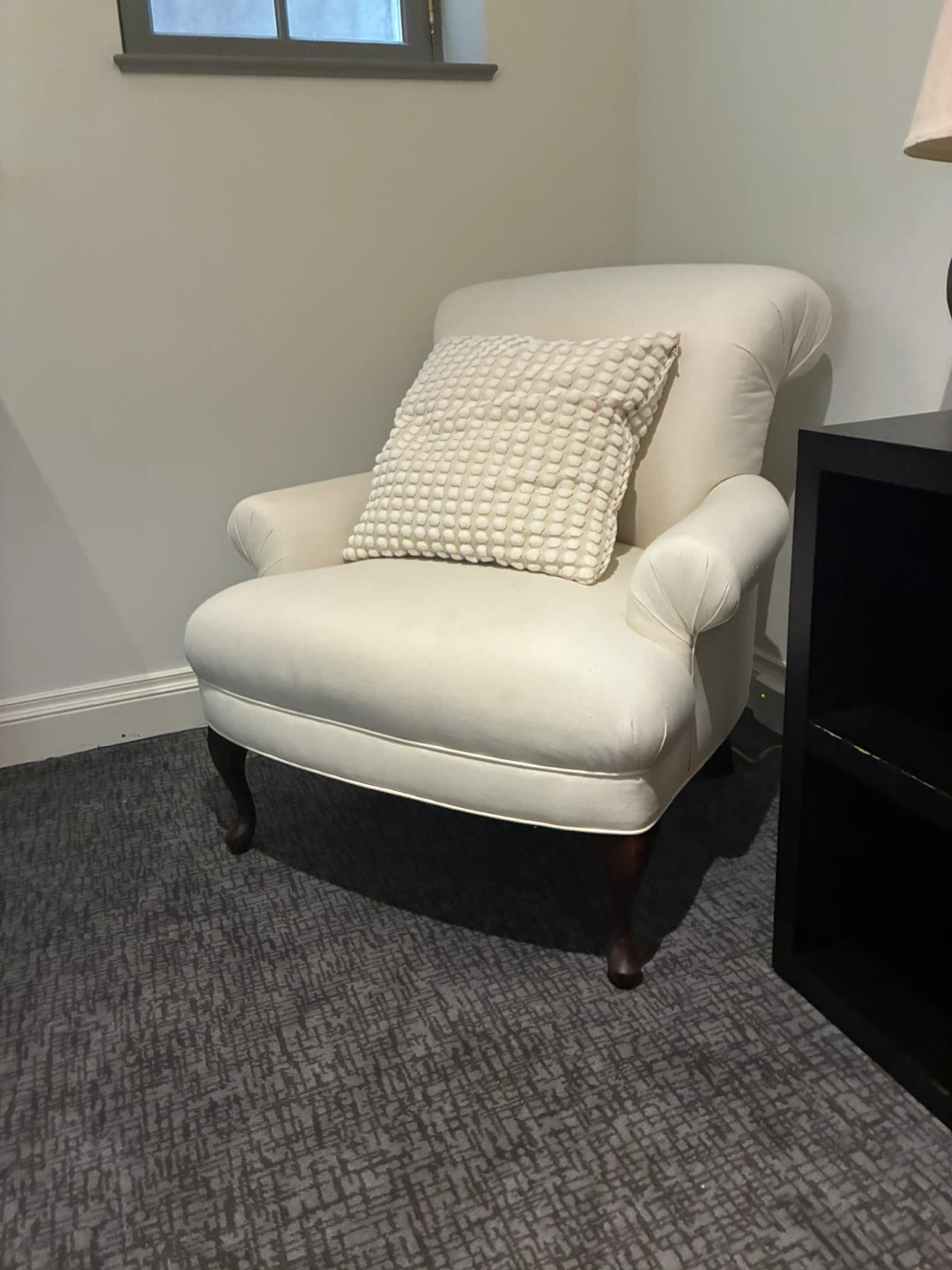 Cream Upholstered Armchair with Decorative Pillow