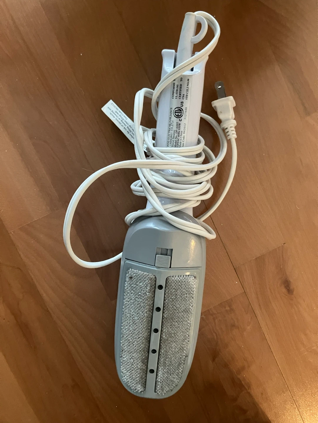 White handheld steamer