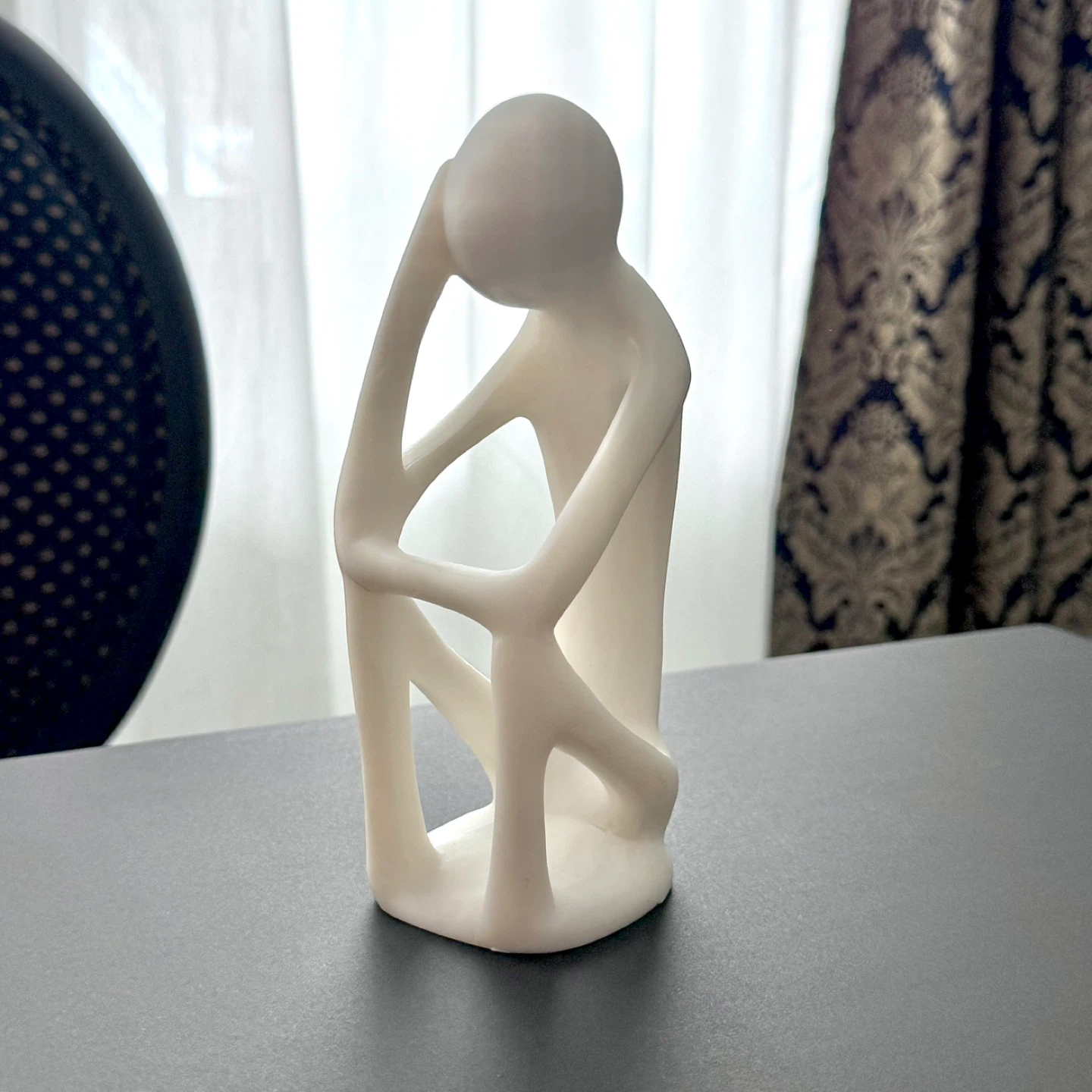 Off-white alabaster thinker sculpture