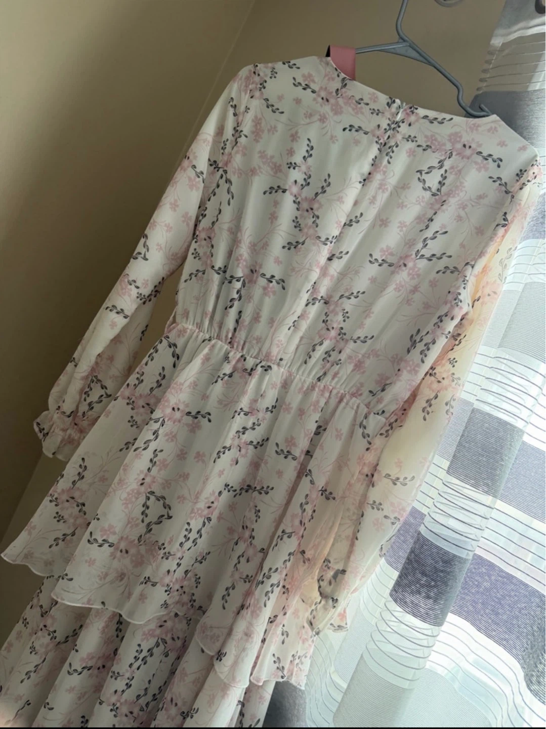 White floral tiered dress with pink belt