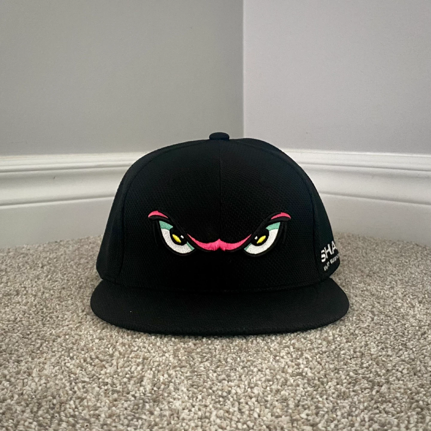 Black Fitted Baseball Cap with Cartoon Eyes Design