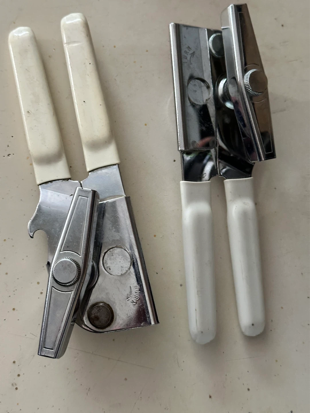 Vintage white handled swing away can opener