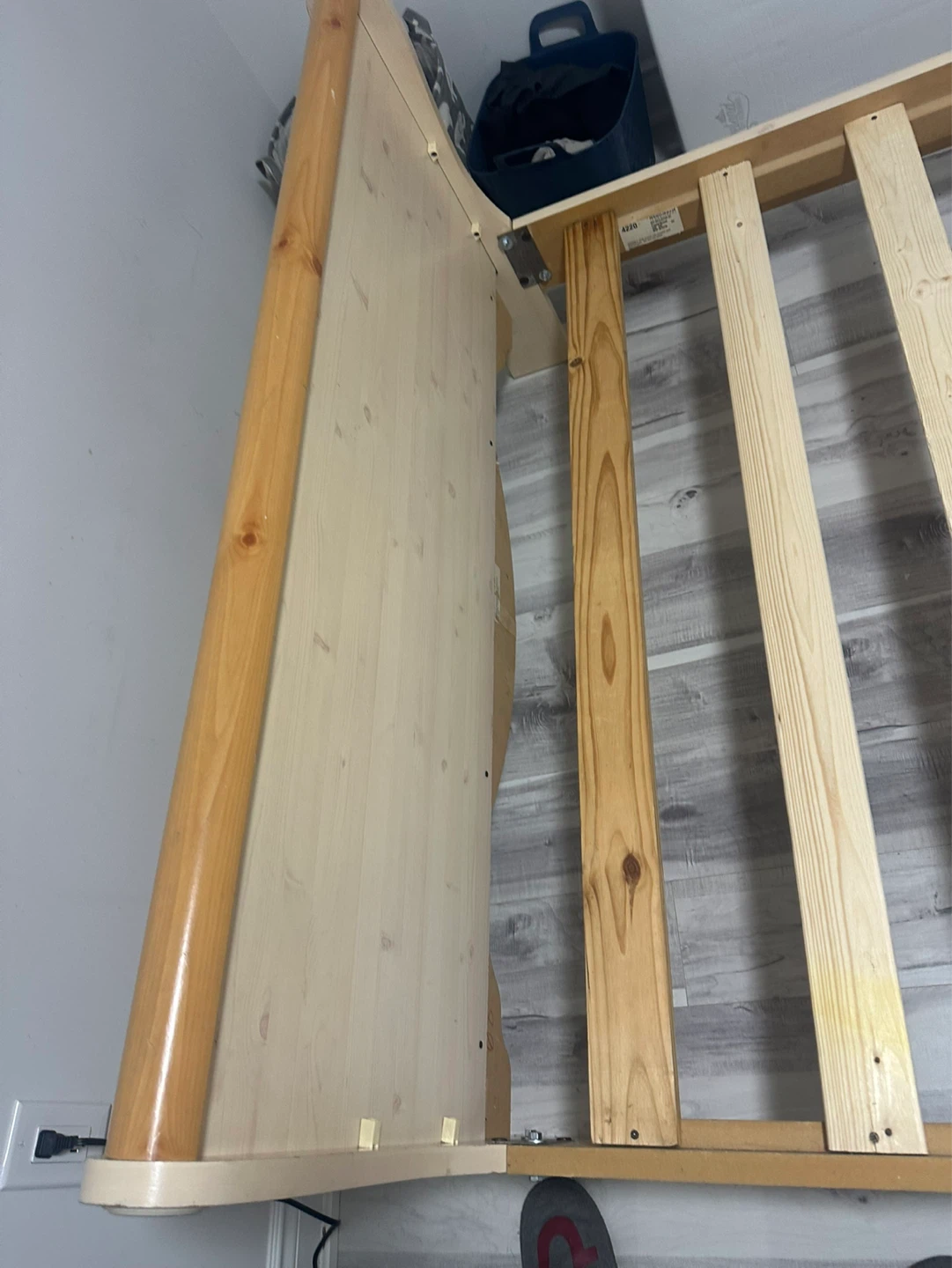 Wooden bed frame with slatted base