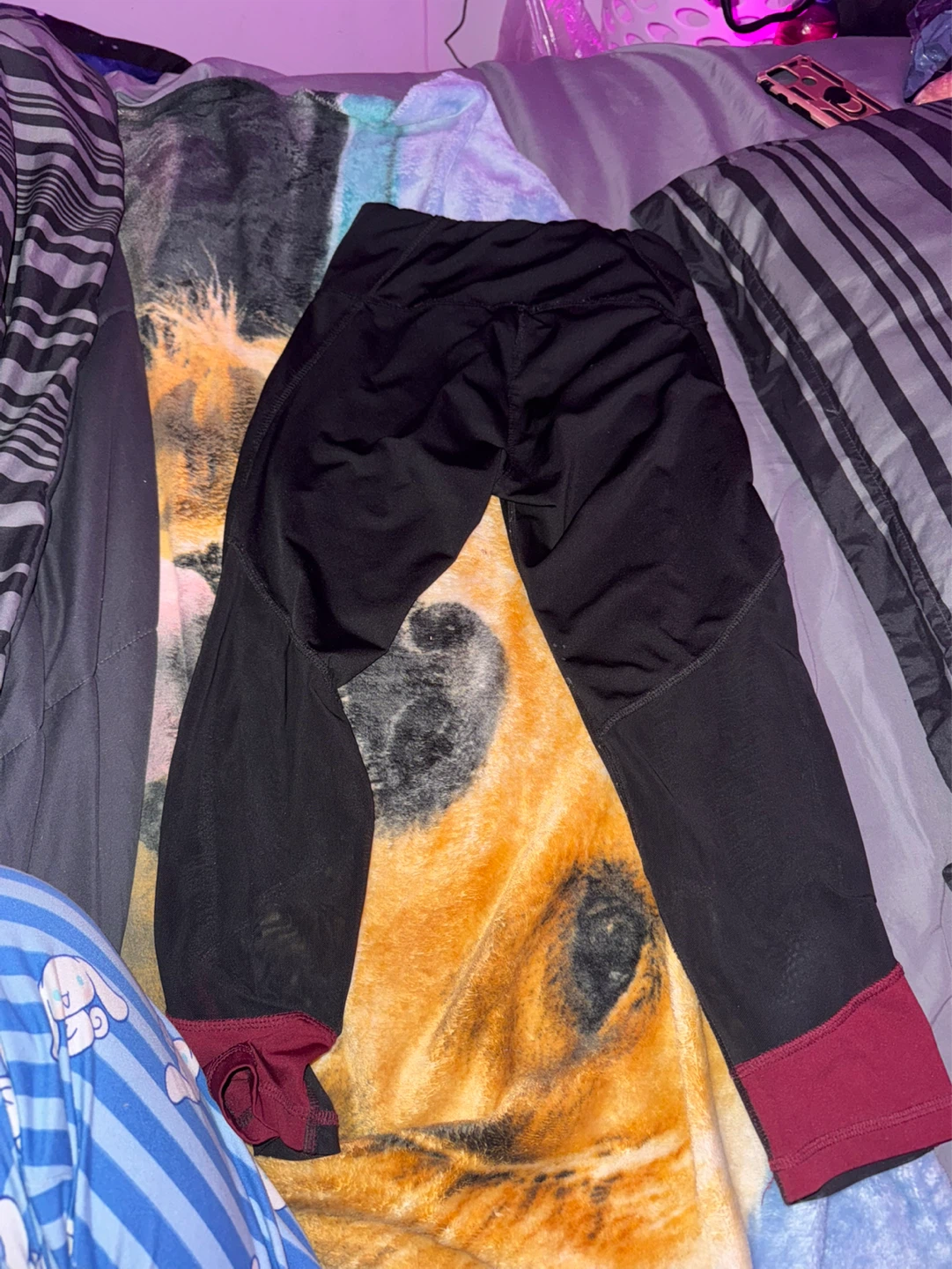 Black athletic leggings with burgundy accents