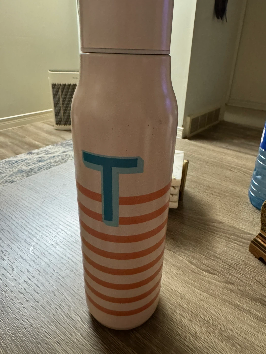 Thermos with 'T' logo