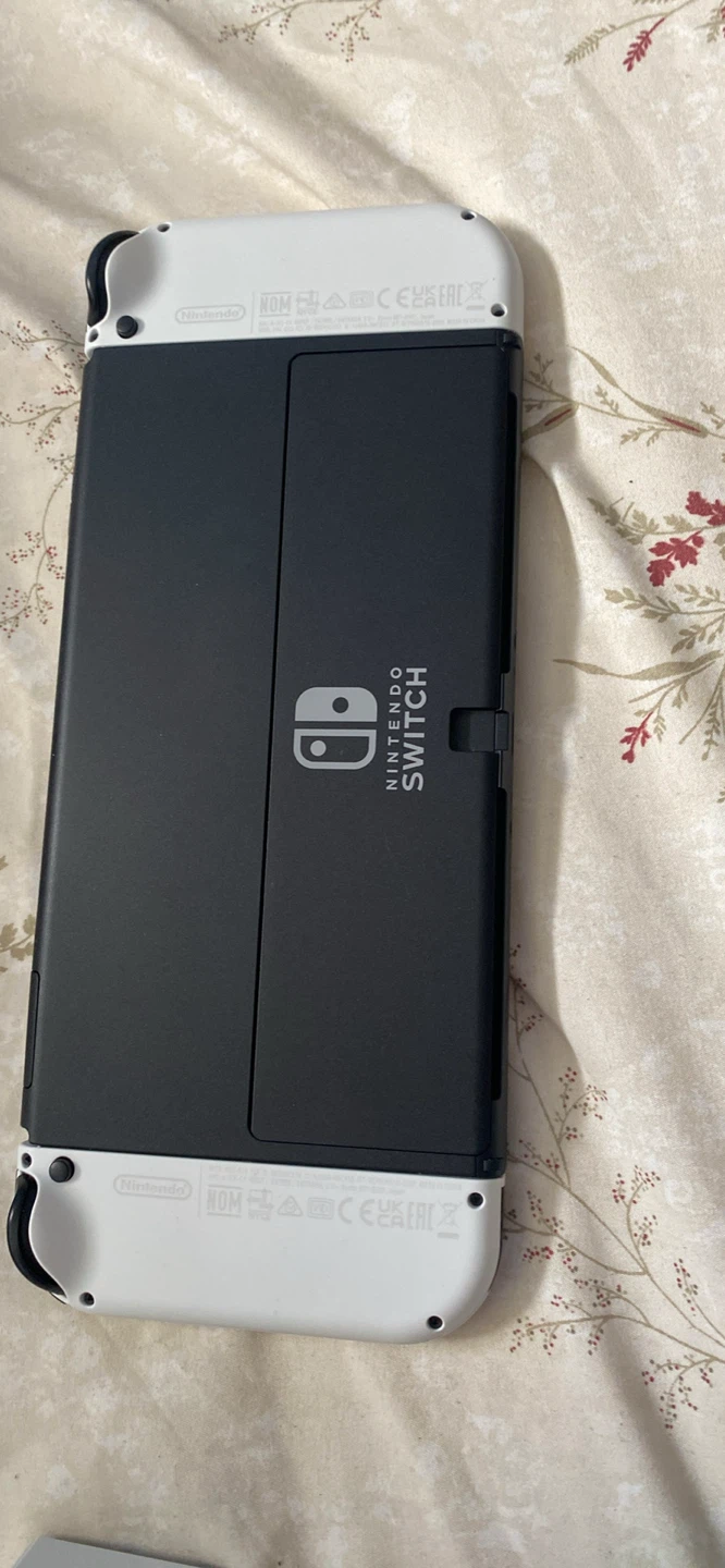 Nintendo Switch OLED Console with 4 Games and Accessories
