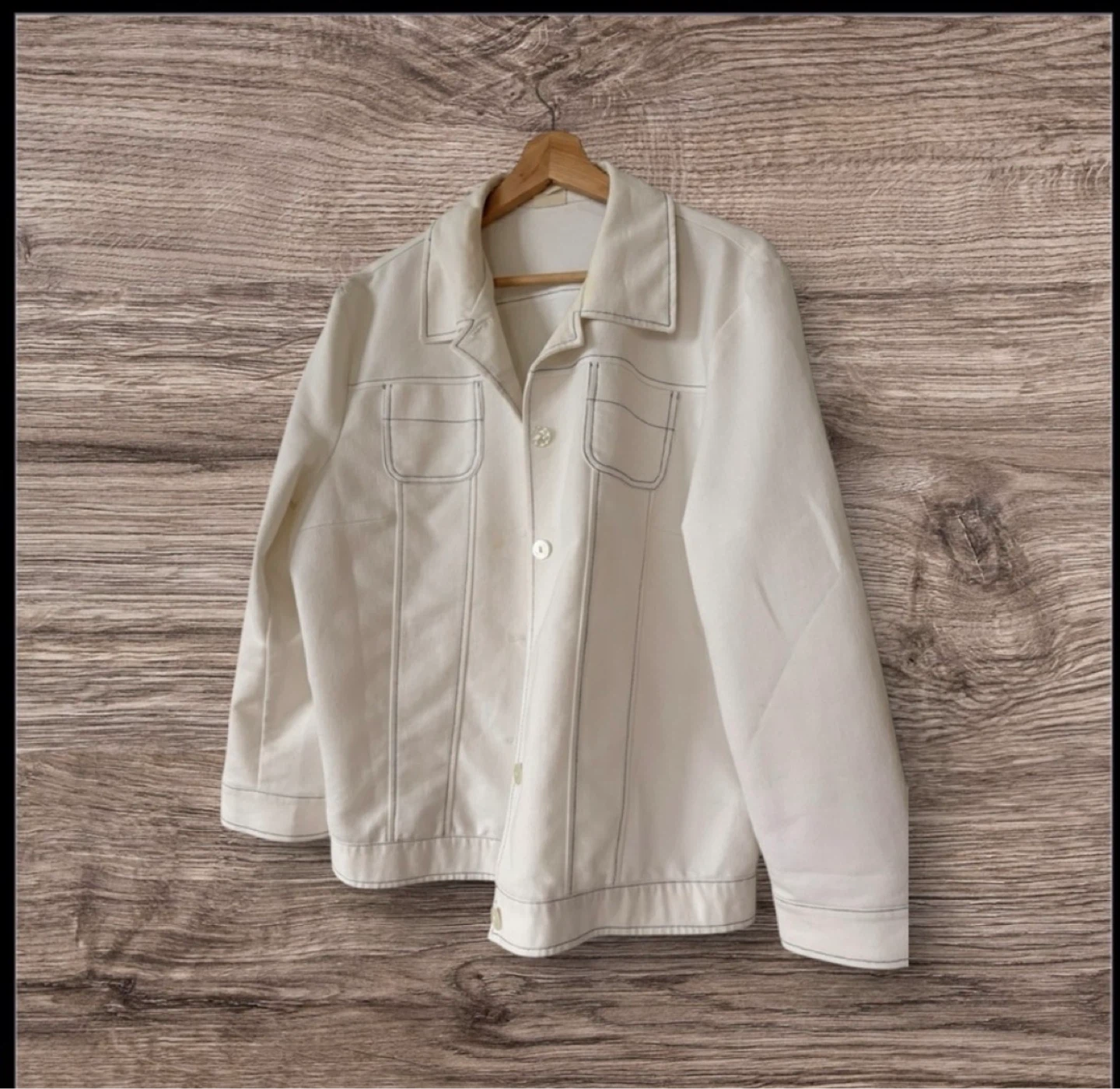 white button-up jacket with contrast stitching