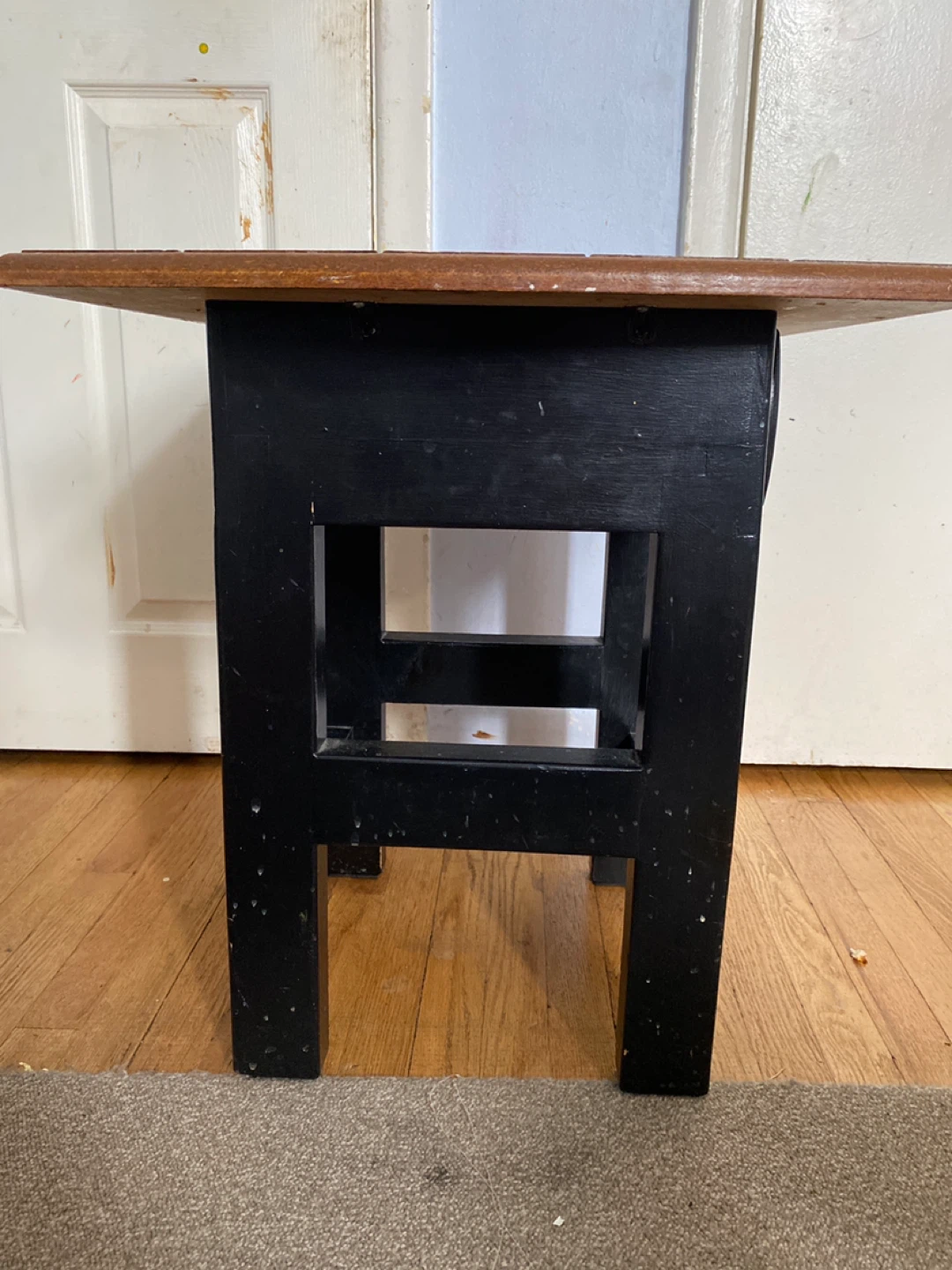 Black accent table with wood top