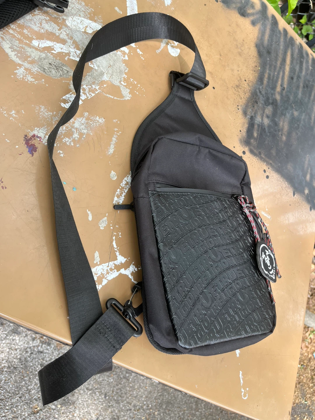 Black Sling Bag with Embossed Logo