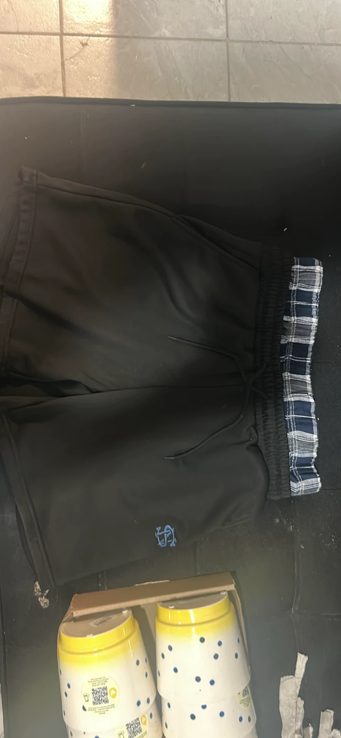 Pantalon jogging noir avec doublure carreaux