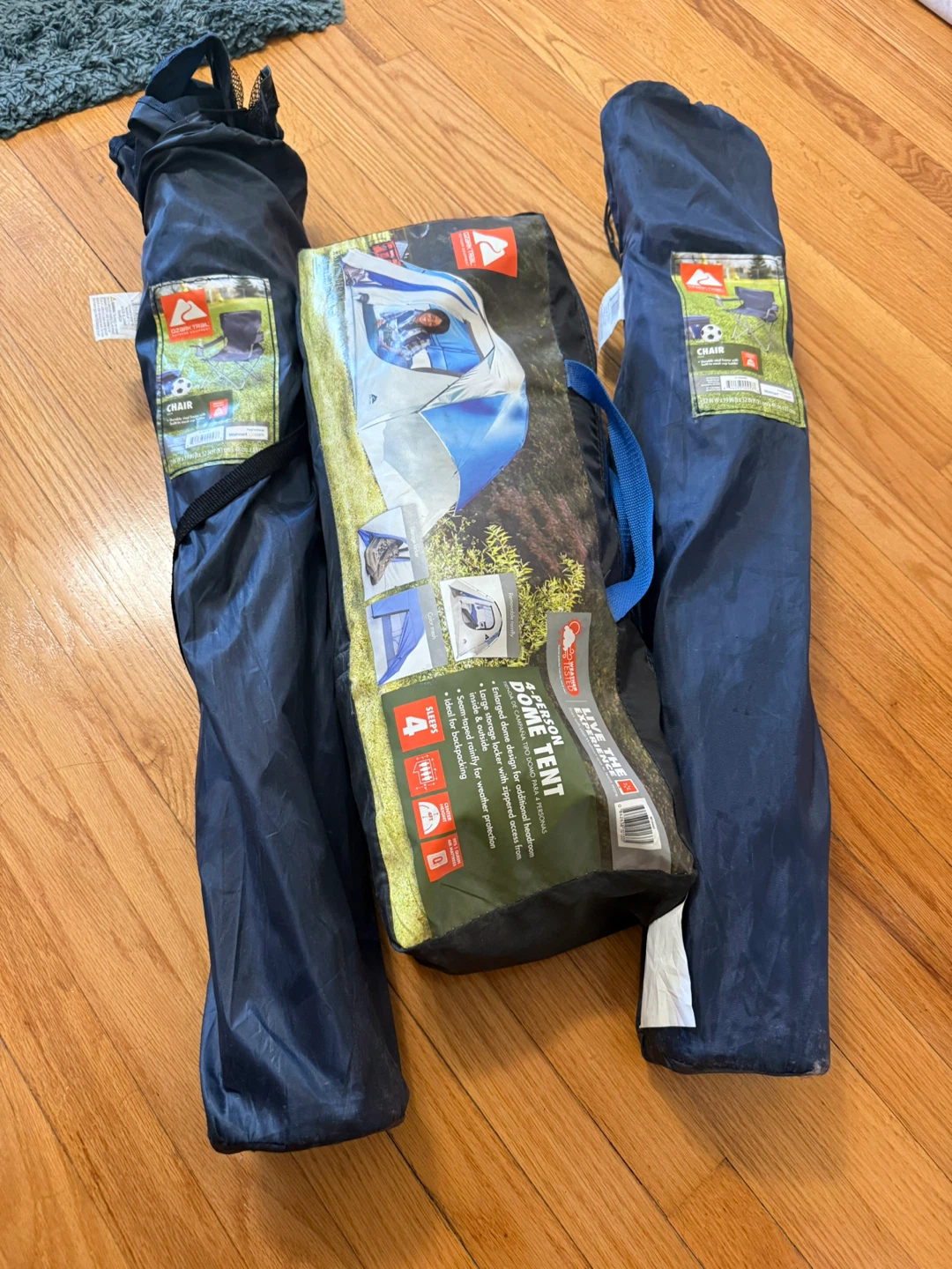 Ozark Trail 4-Person Dome Tent and camping chairs
