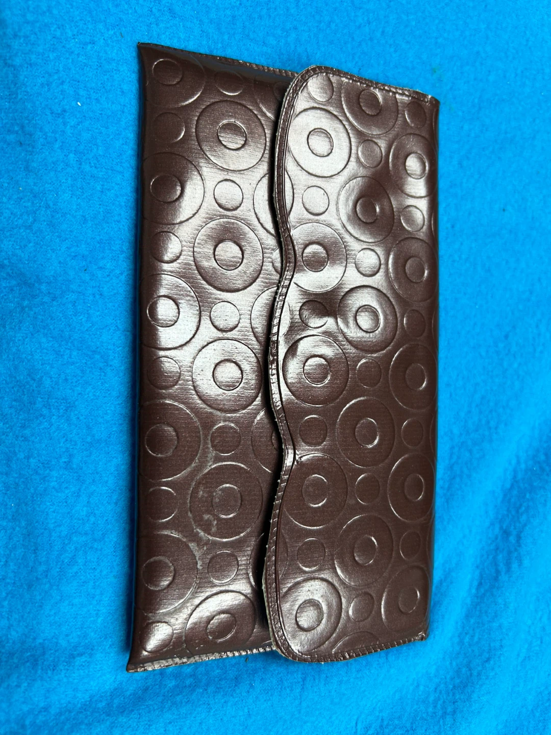 Brown leather patterned clutch with heart mirror