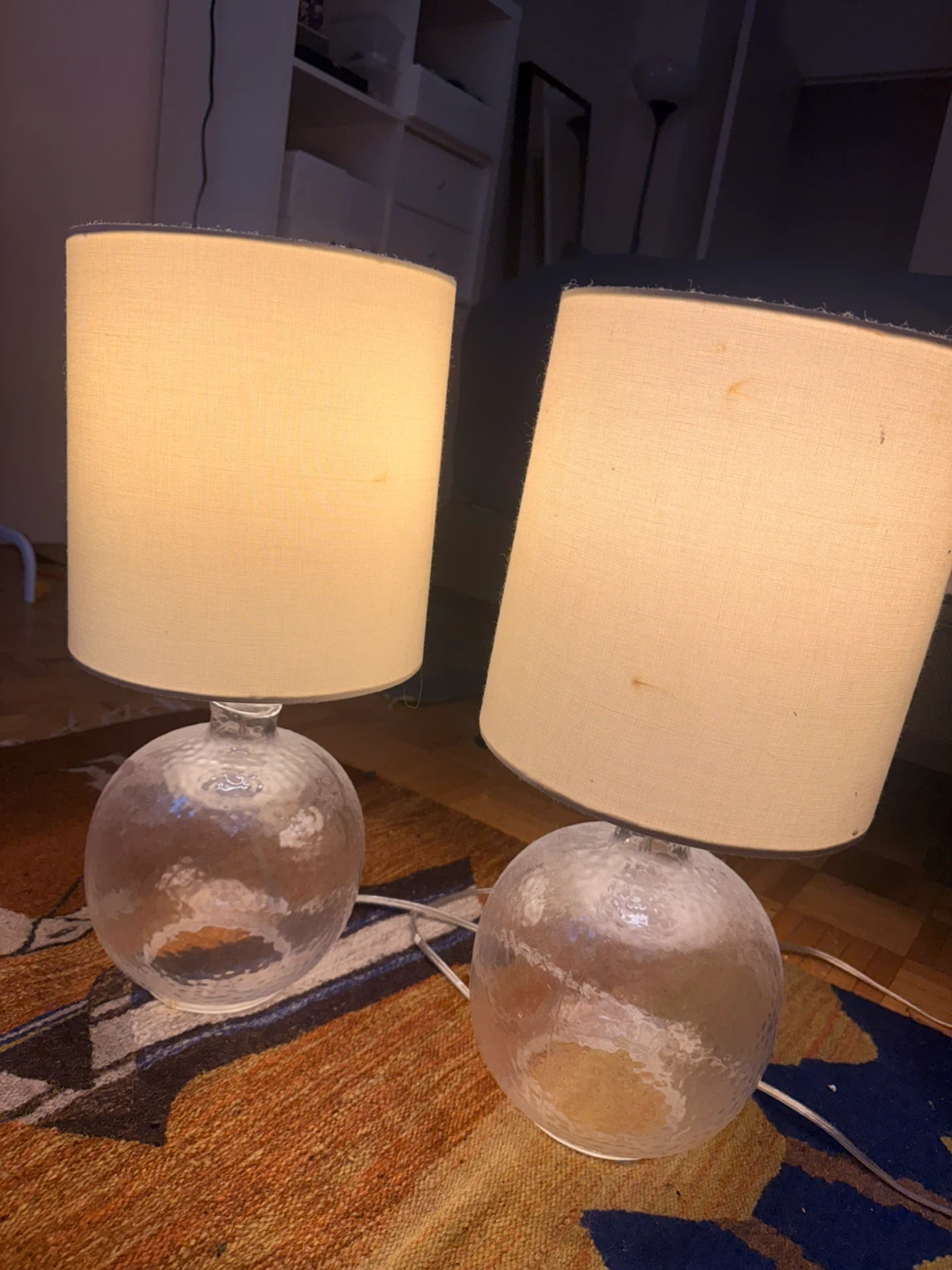 Set of 2 clear glass base table lamps with beige shades