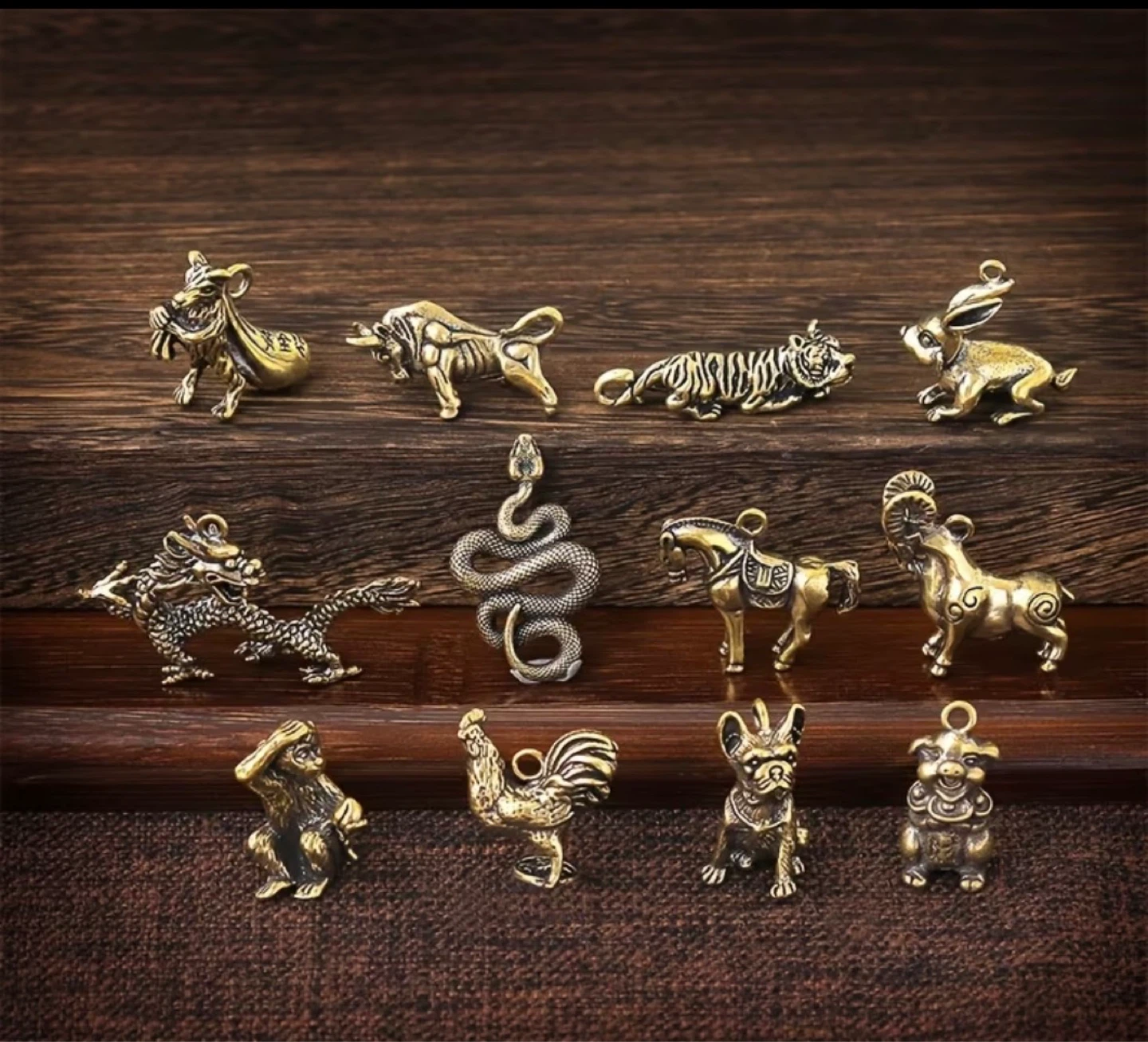 A set of 12 bronze Chinese zodiac animal pendants