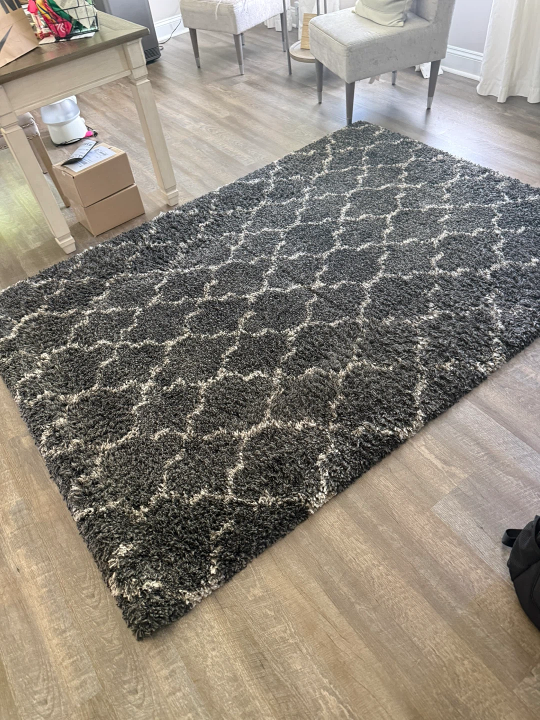 Gray shag rug with white geometric pattern