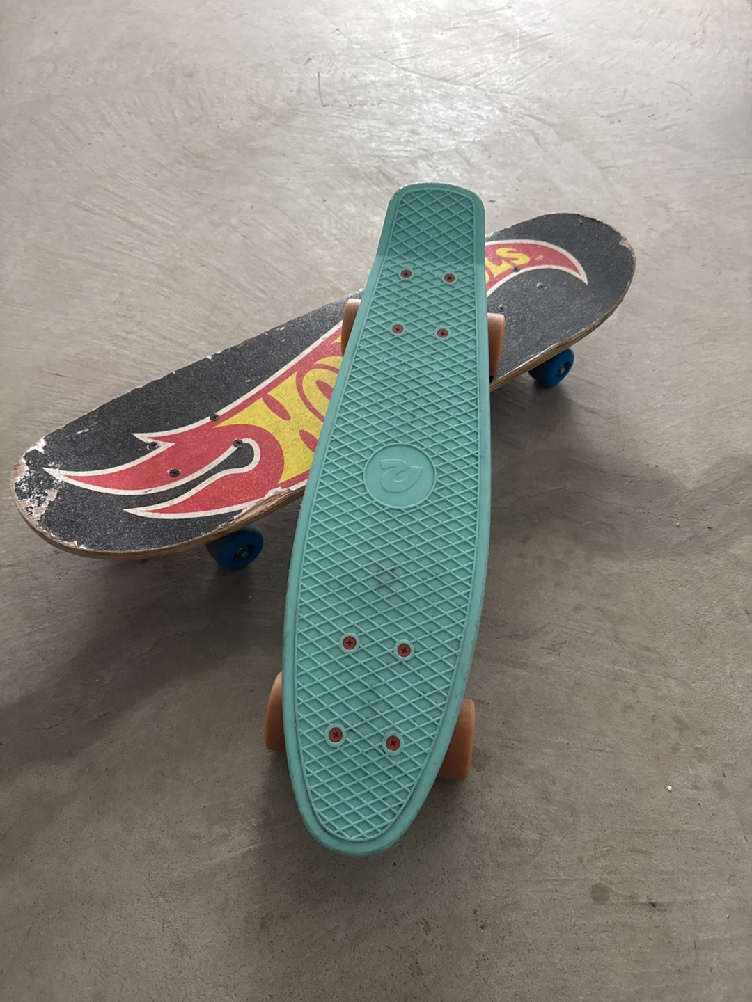 Two skateboards: Hot Wheels and Penny-style