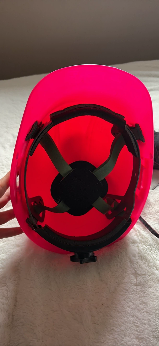 Pink Safety Hard Hat and Black Work Boots