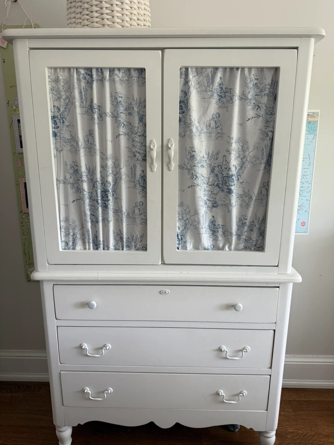 White Armoire with Blue Toile Curtains and Drawers