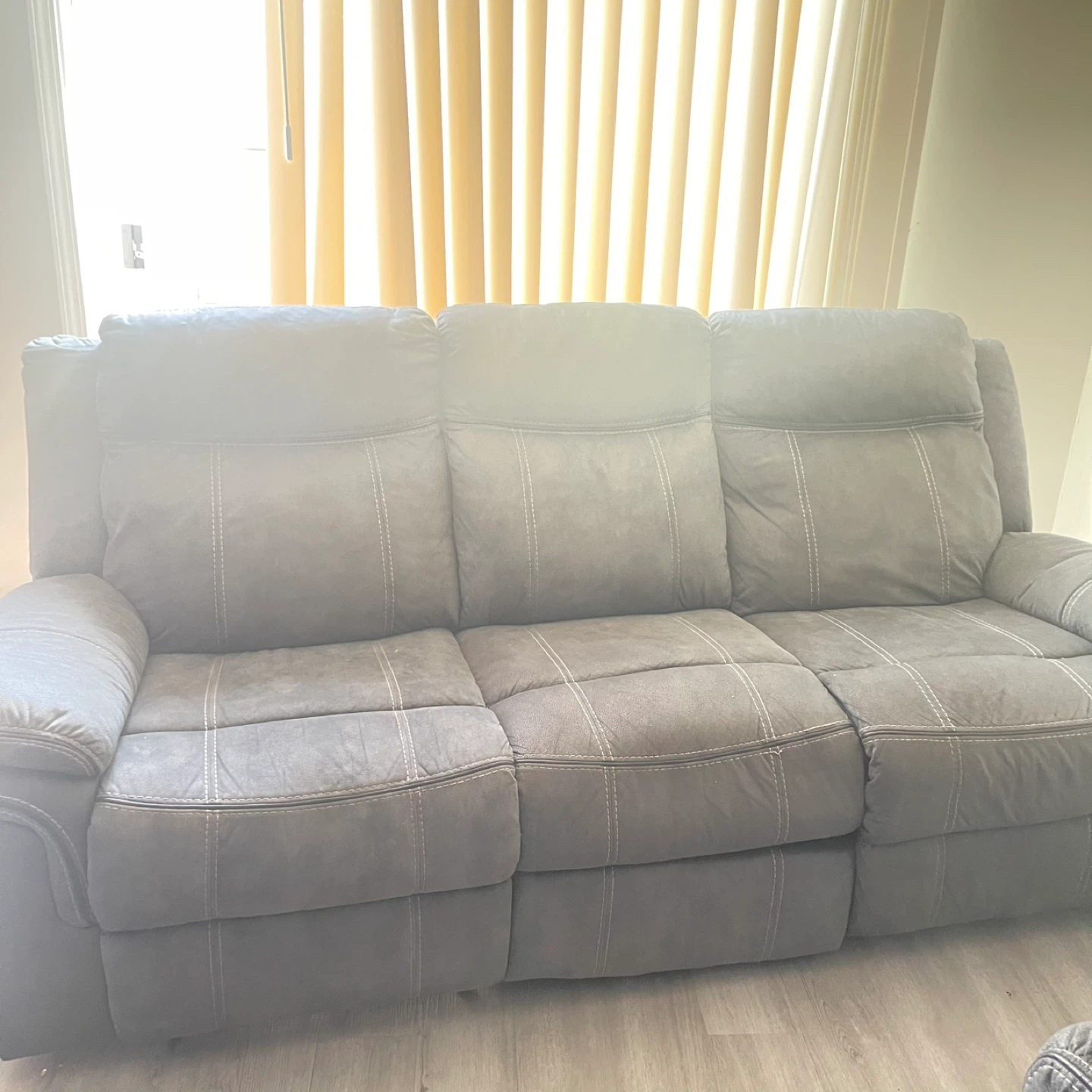 Gray Reclining Sofa with Center Console and Cup Holders