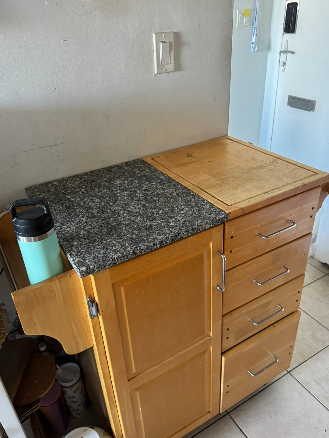 Wooden kitchen cart with granite and butcher block top