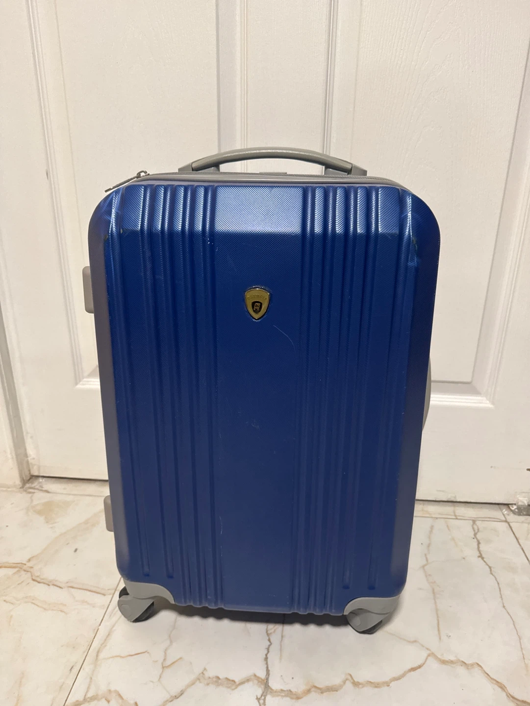 Olympia blue rolling suitcase