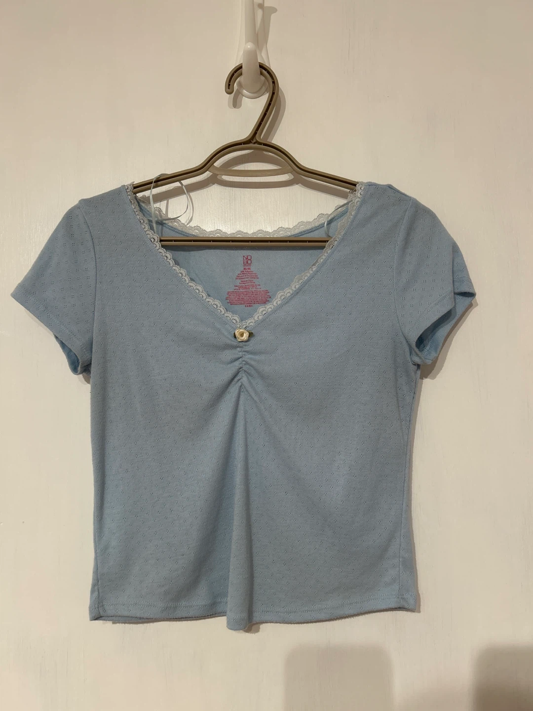 Blue shirt with rose