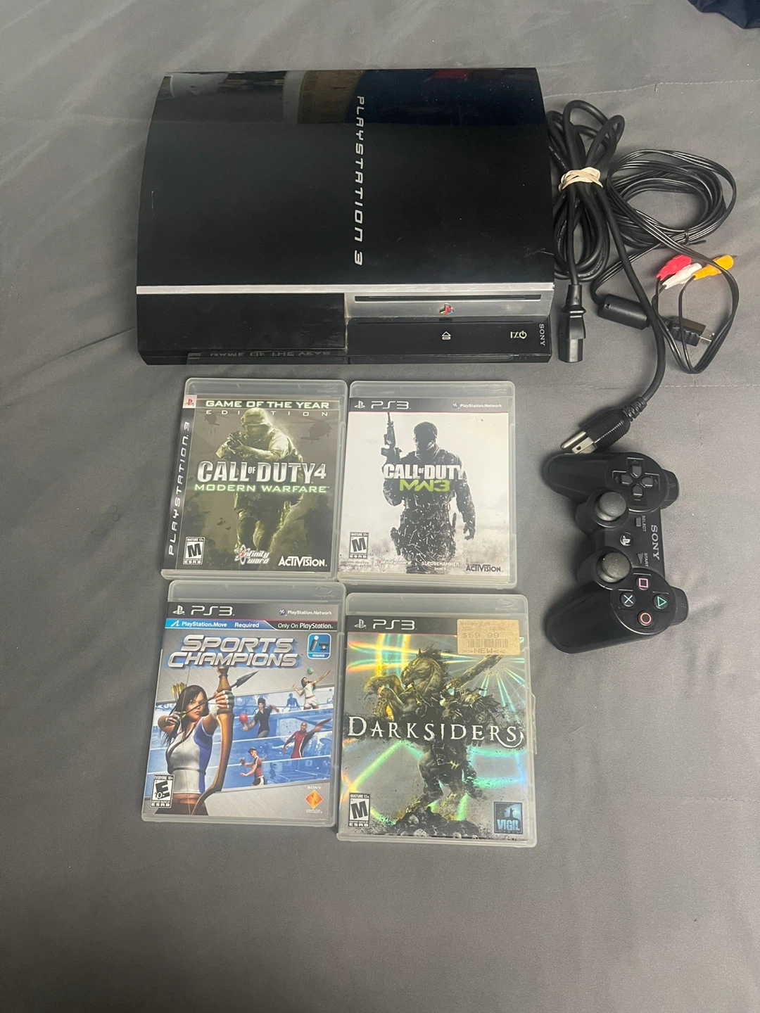 PlayStation 3 Console Bundle with 4 Games