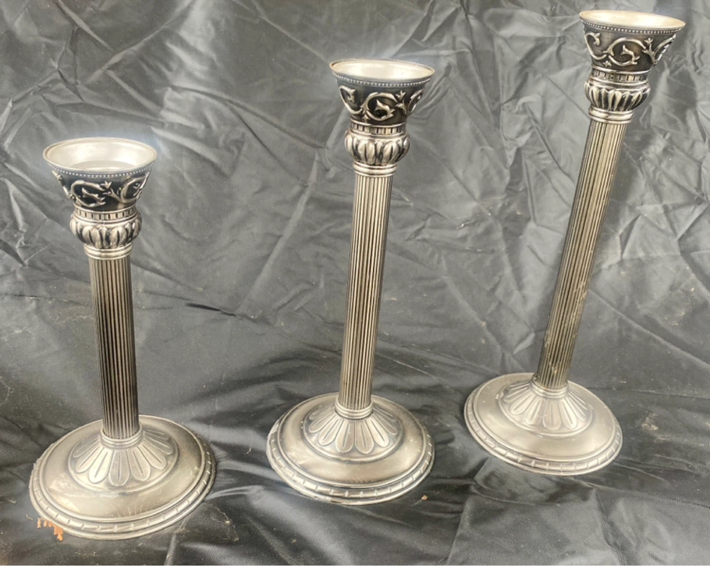 Set of 3 ornate silver-tone candlesticks