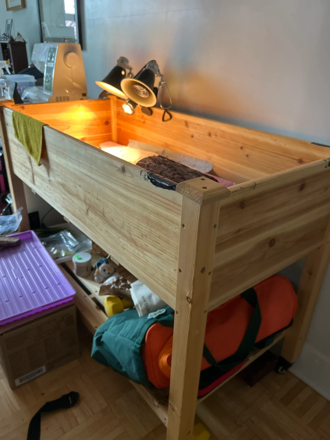 Wooden terrarium with heat lamps