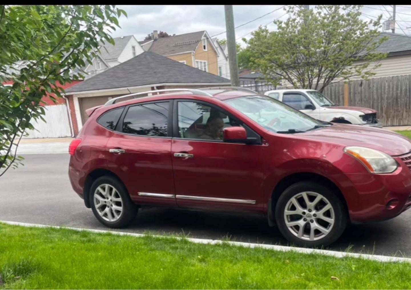 Red Nissan Rogue SUV
