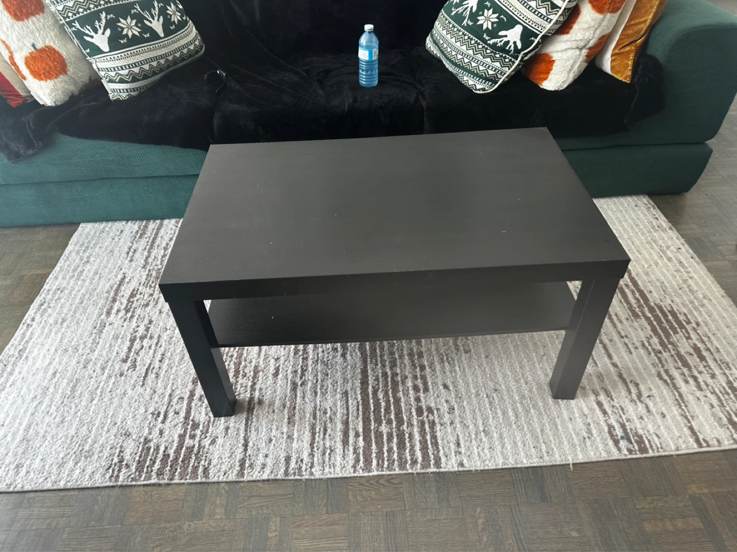 Black coffee table with shelf