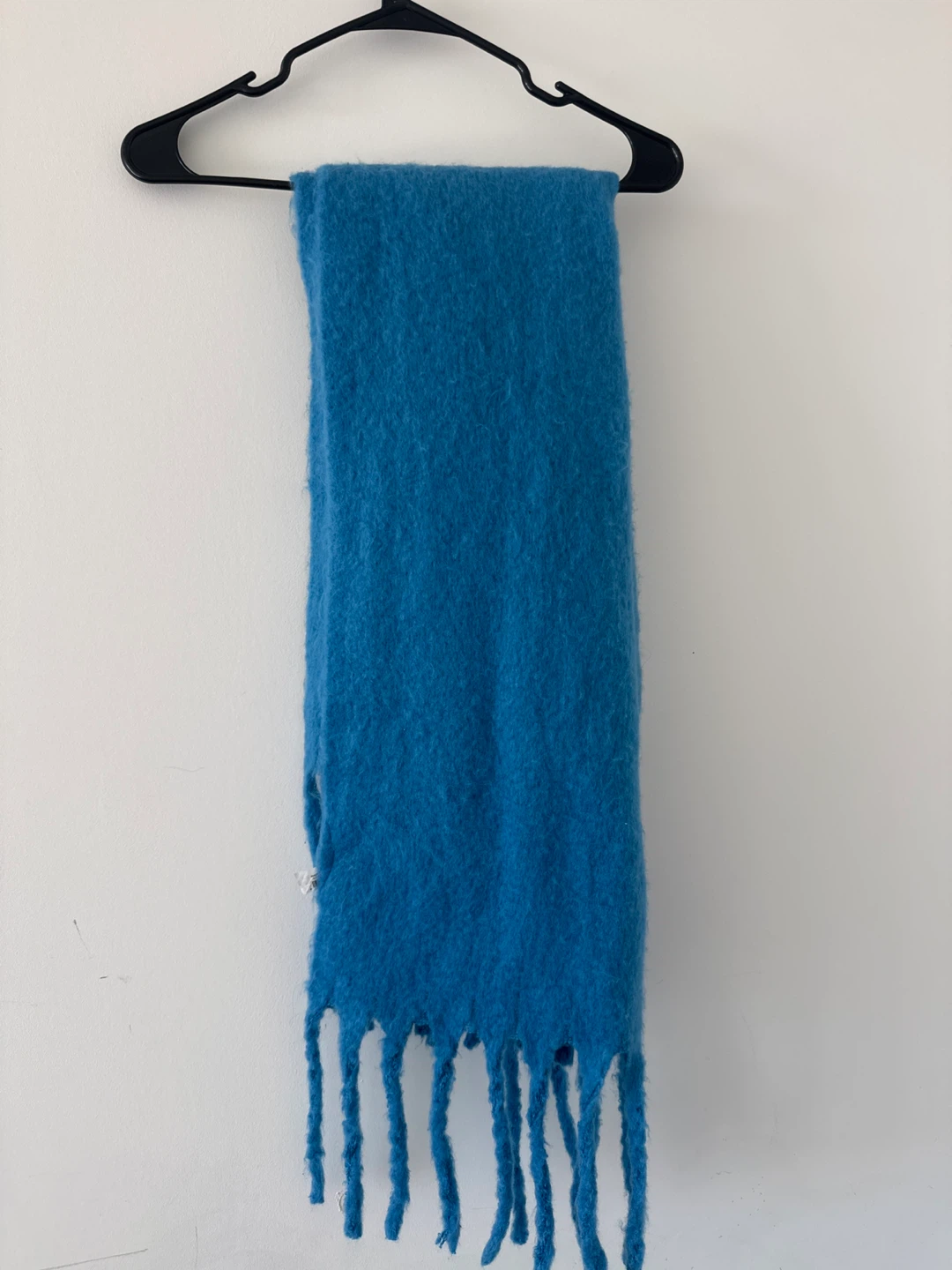 Blue fuzzy scarf with fringe
