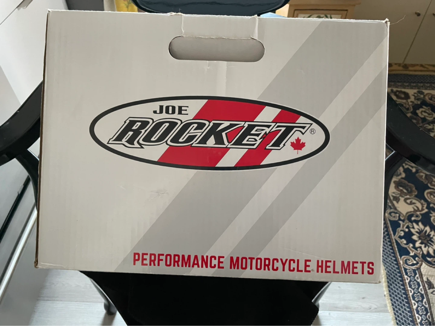 Bikers helmet box with a bag, guide book, and a visor