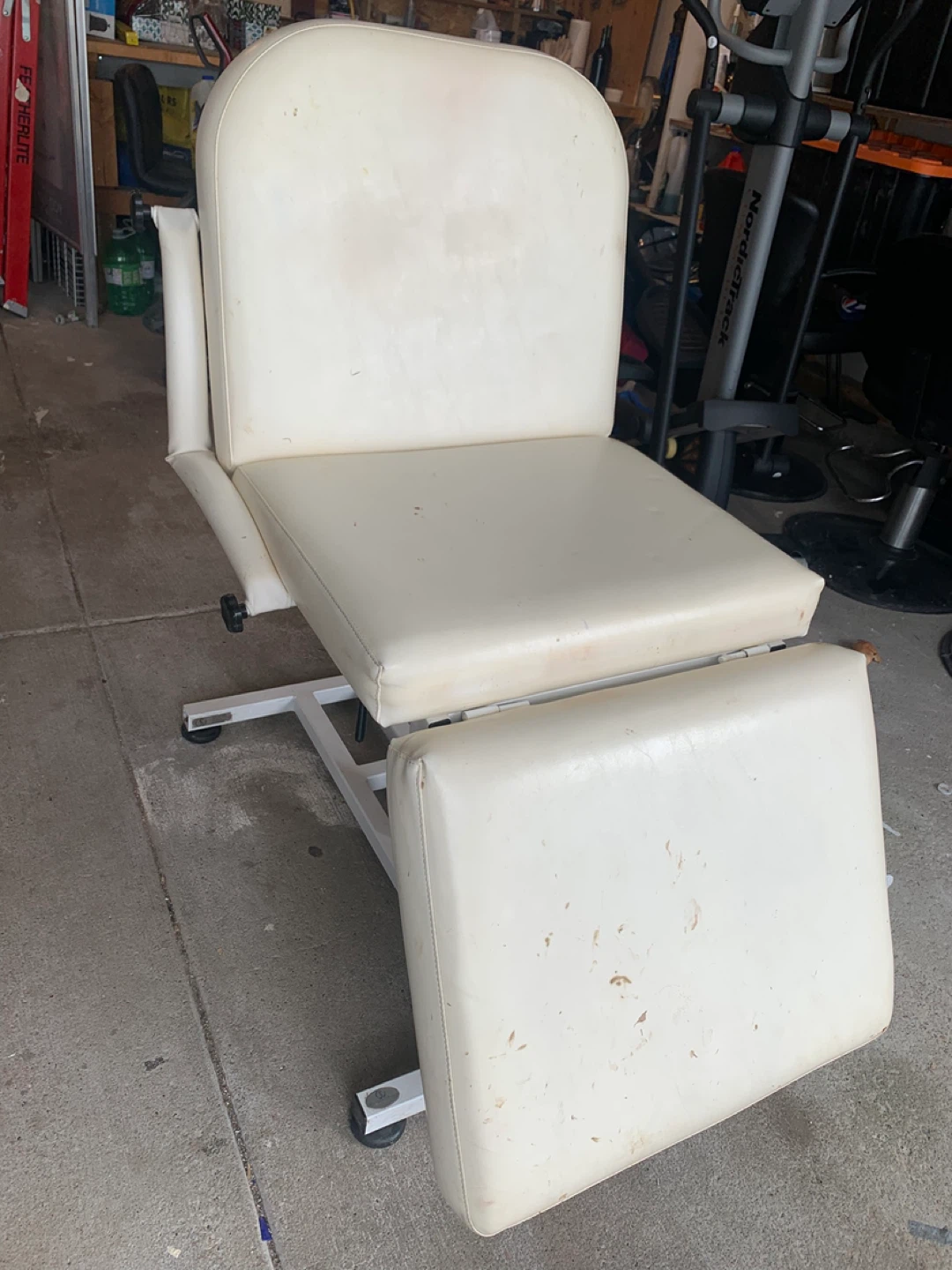 Cream coloured salon chair with footrest