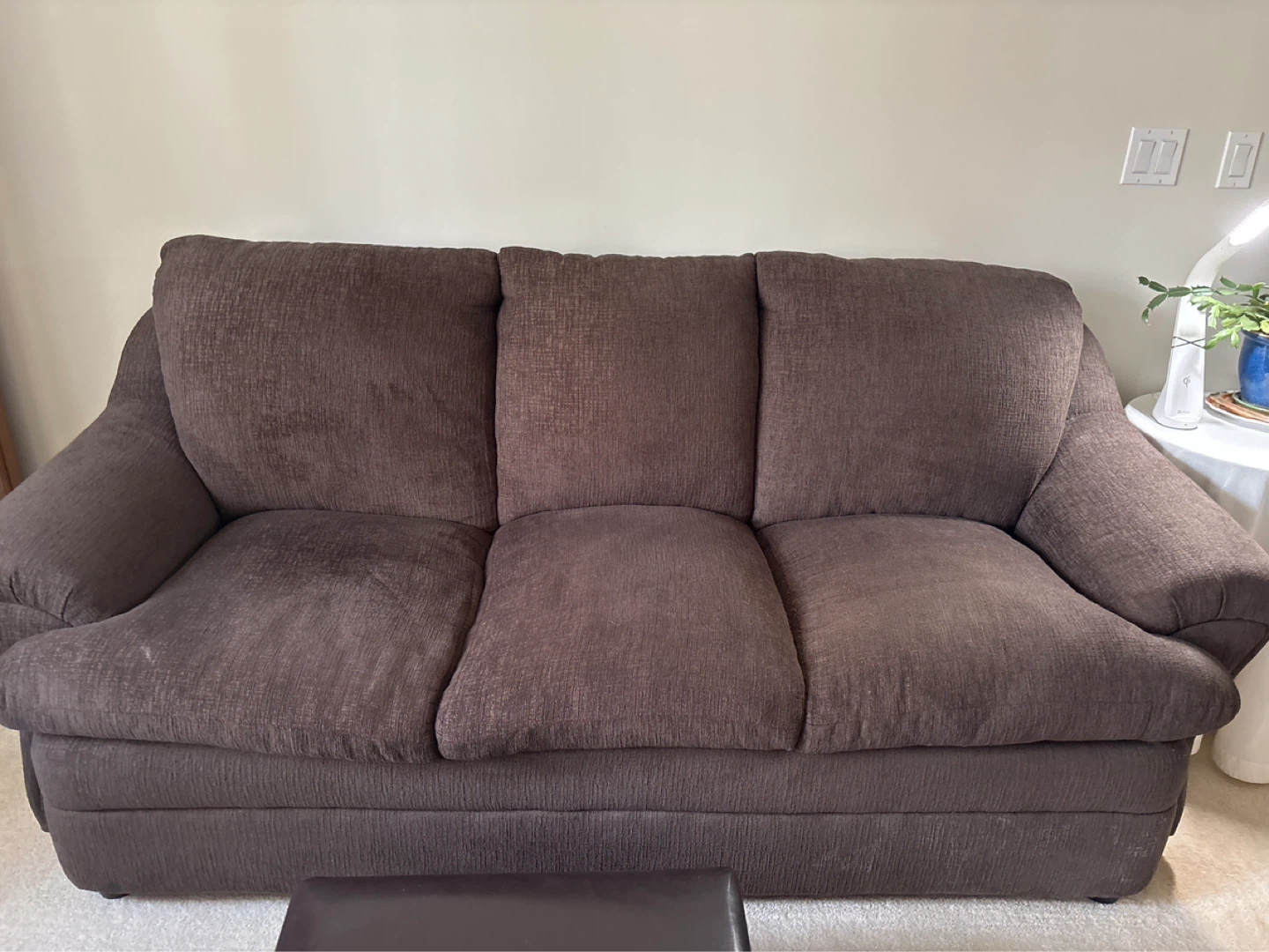 Brown three-seater sofa