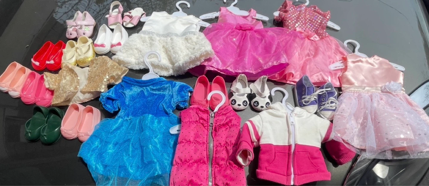 Various doll outfits and shoes.
