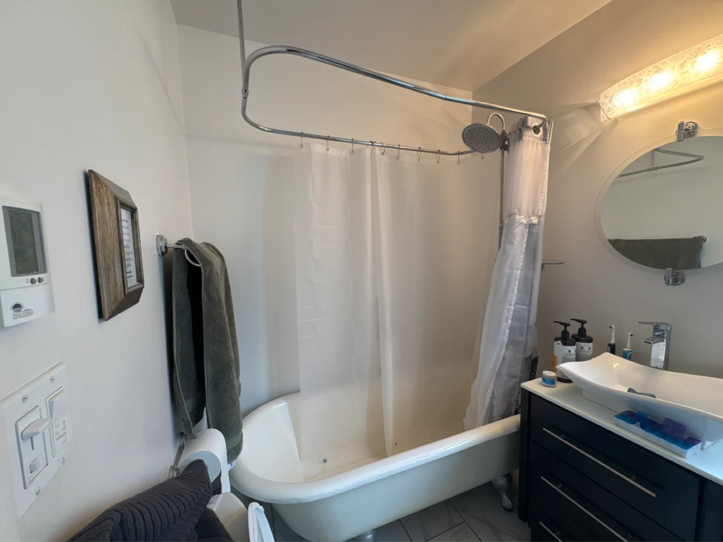 Clawfoot Bathtub with Shower Enclosure