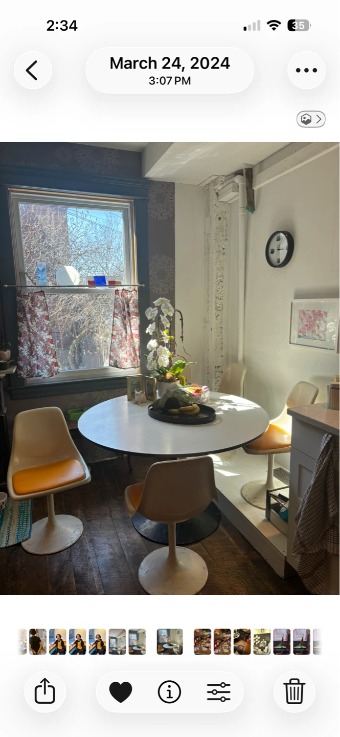 Original 1950s Tulip table and four swivel chairs.