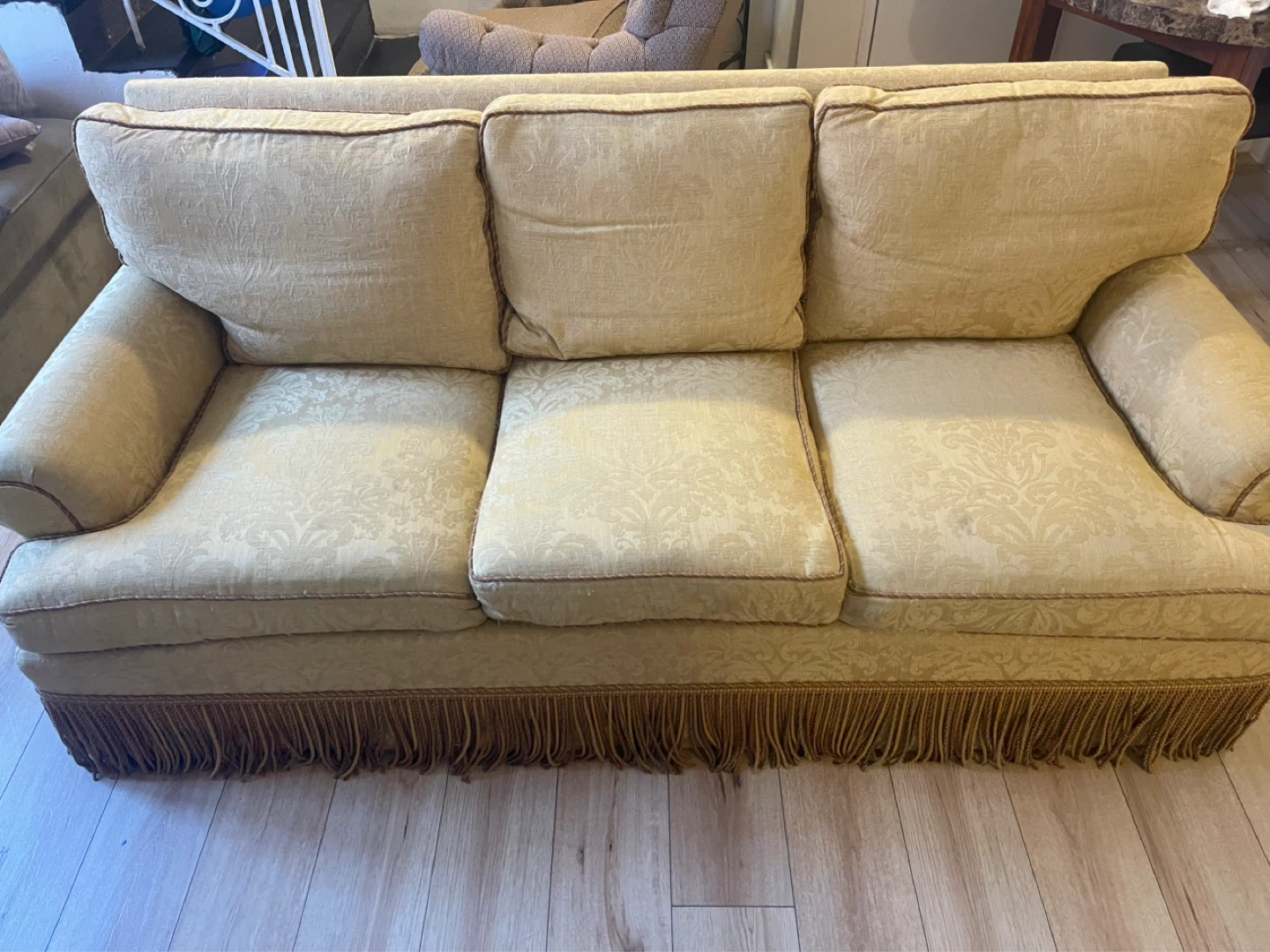 Yellow Sofa with Decorative Pattern and Fringe