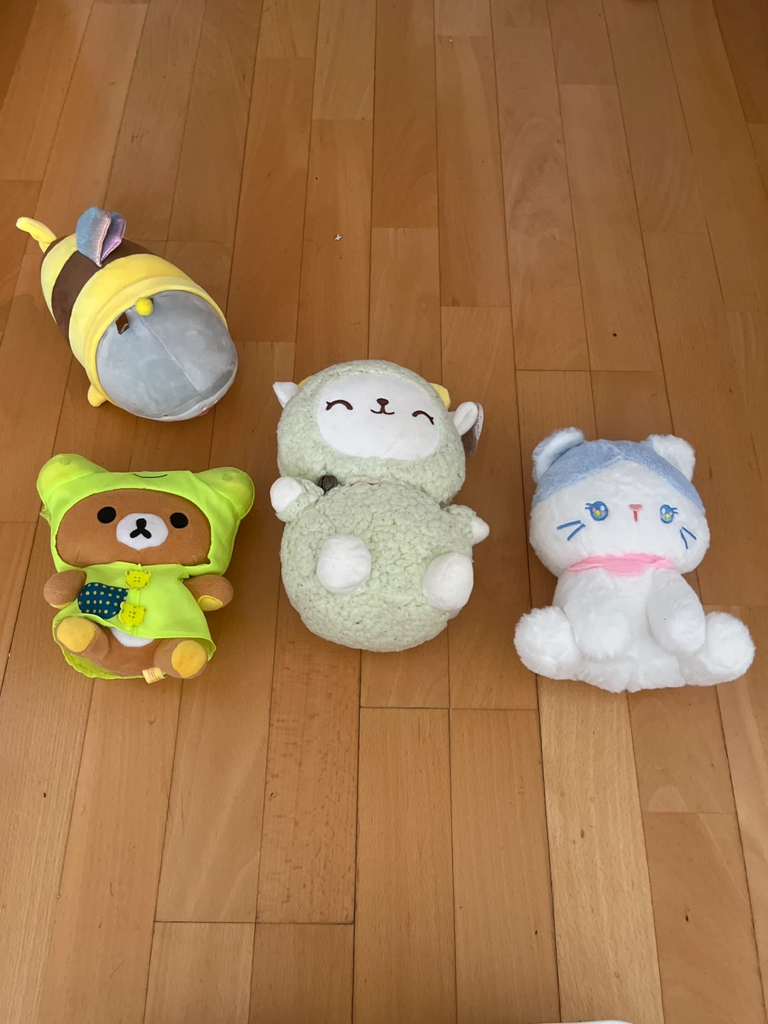 Four Plush Toys: Rilakkuma Bear, Sheep, Cat, and Bee