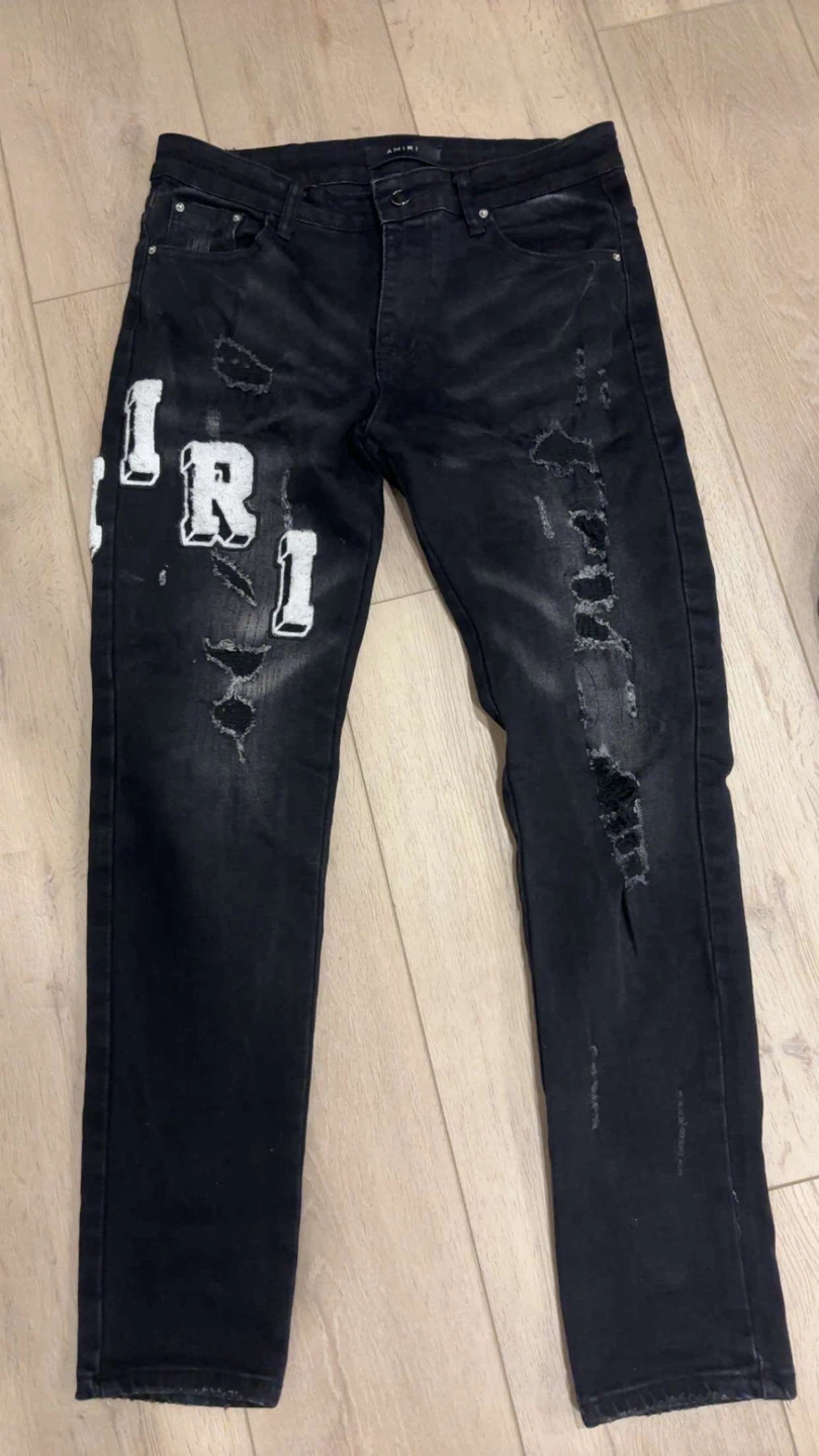 AMIRI Black Distressed Patch Logo Jeans