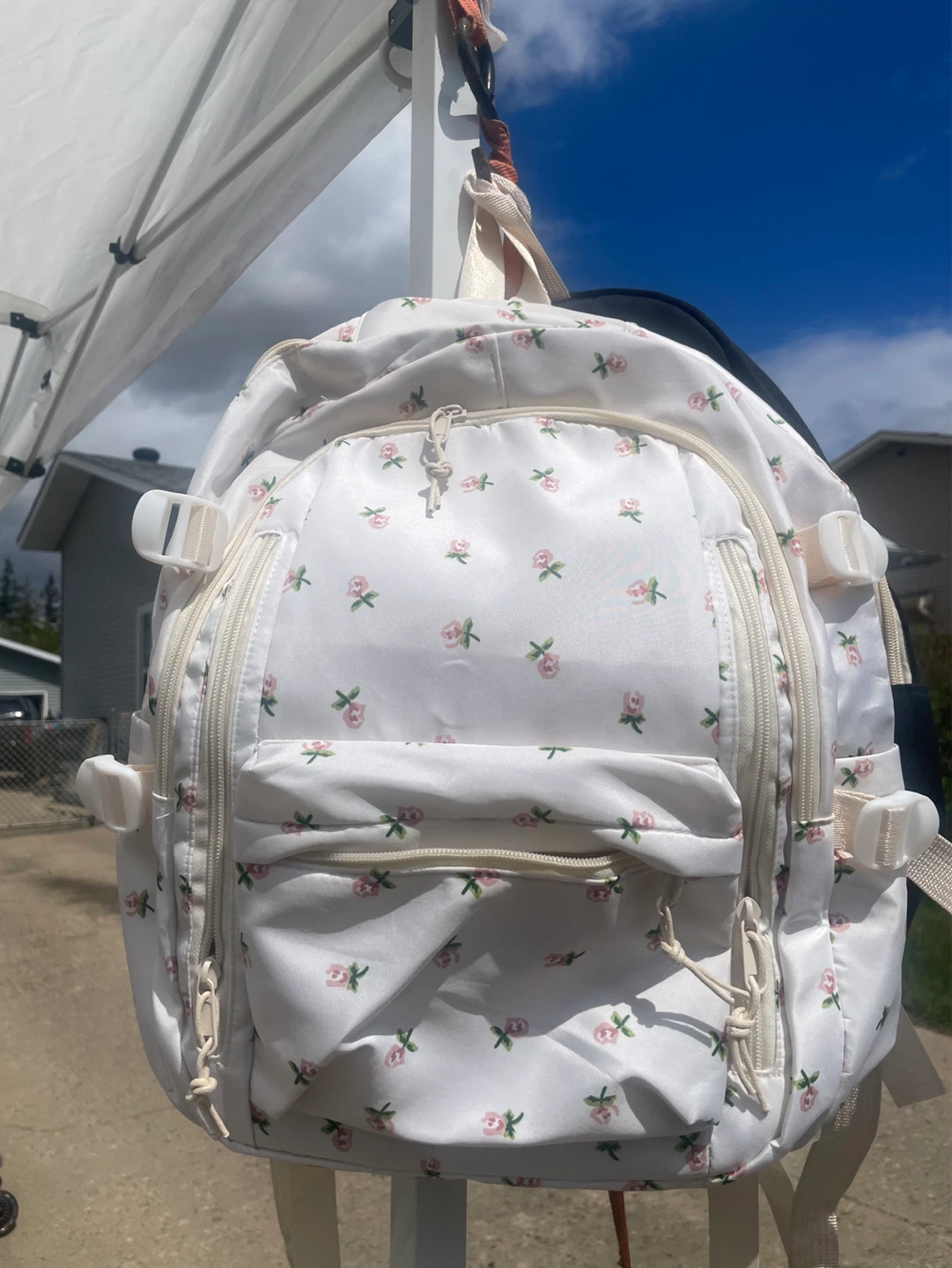 White flower backpack and black backpack
