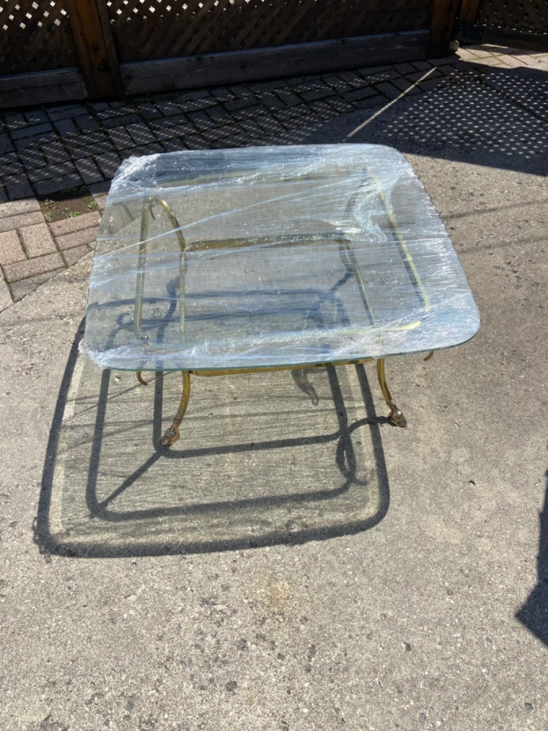 Square Glass top coffee table with brass base