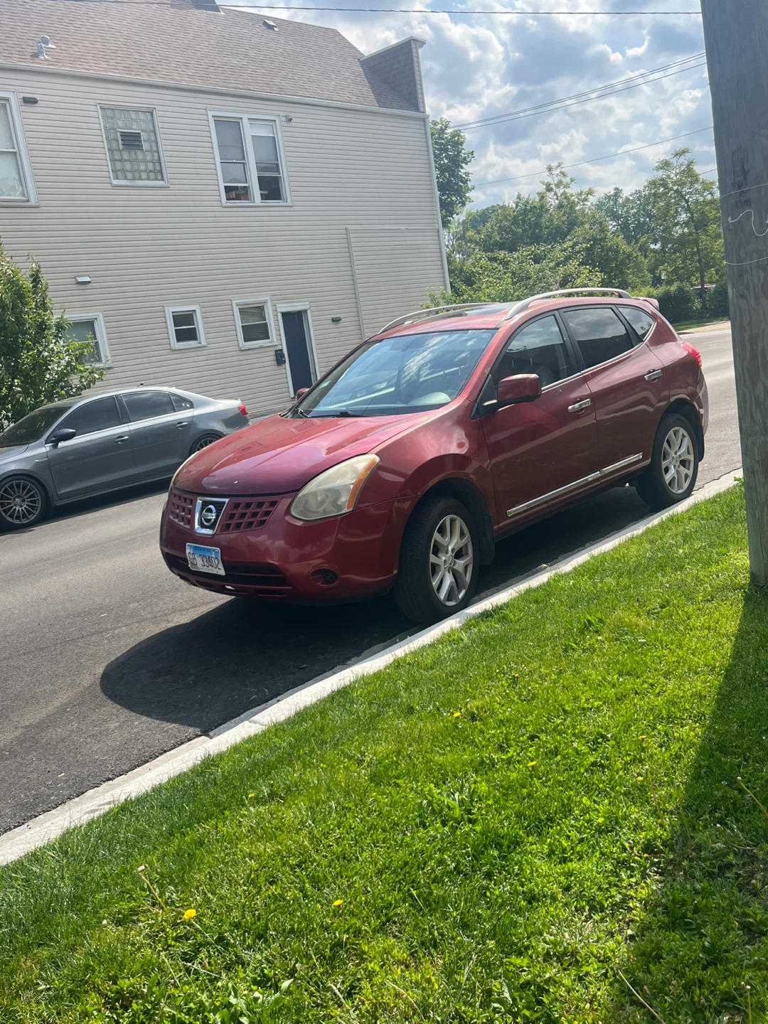 Red Nissan Rogue SUV 2013
