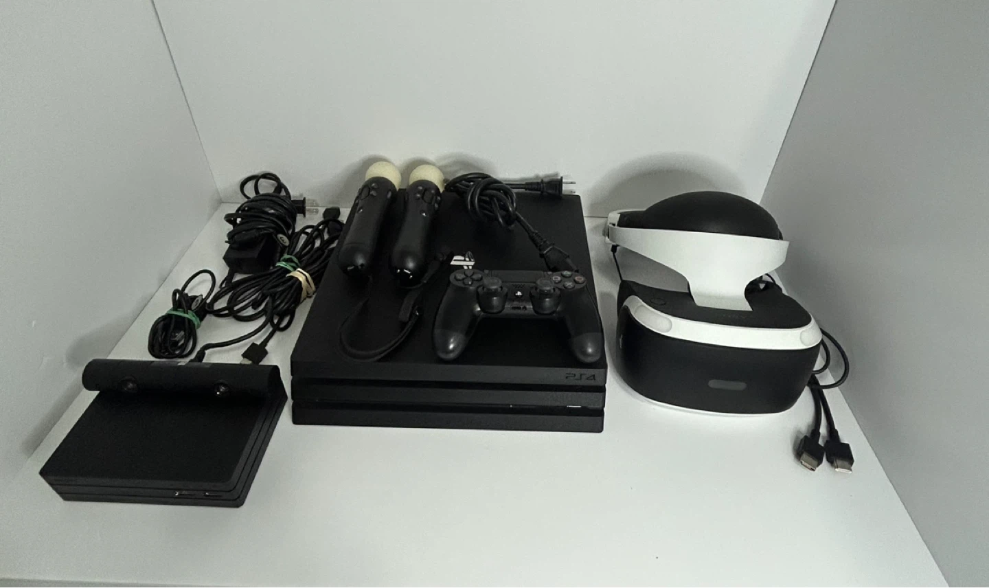 PlayStation 4 Pro with VR headset, controller, and games